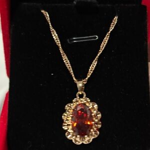 Gold-Tone Necklace with Red Oval Crystal Pendant by